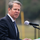 Illustration for article titled Georgia Gov. Brian Kemp Won't Let the Death Threats Stop Him From Ass-Kissing Donald Trump